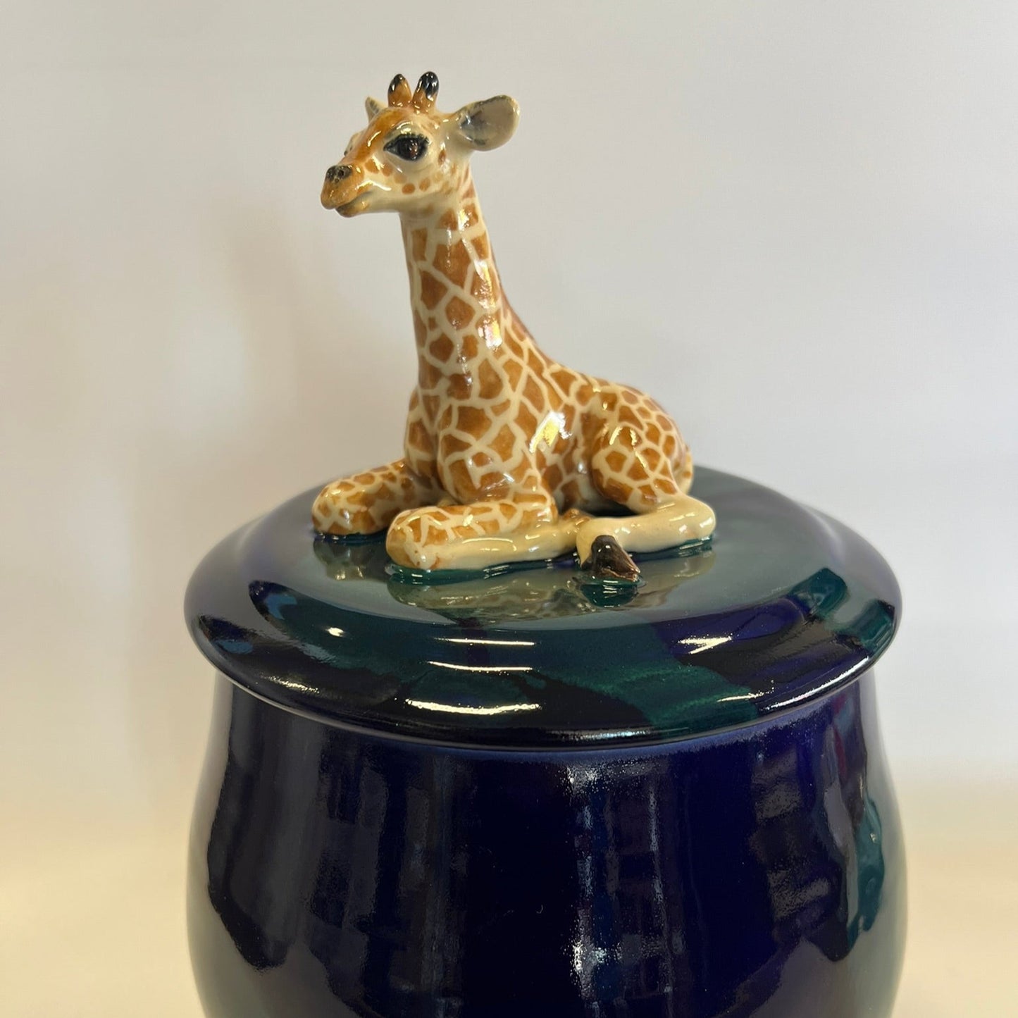 Sold Giraffe on blue