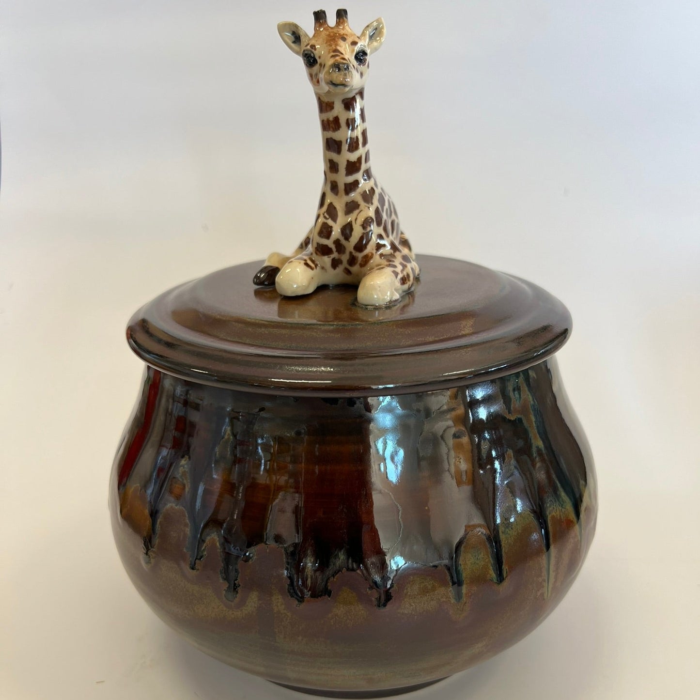 Available Giraffe on Red Brown