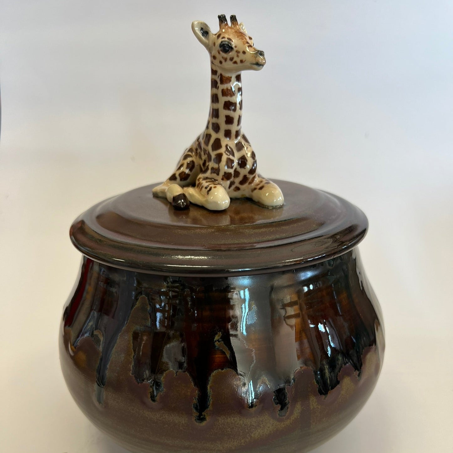 Available Giraffe on Red Brown