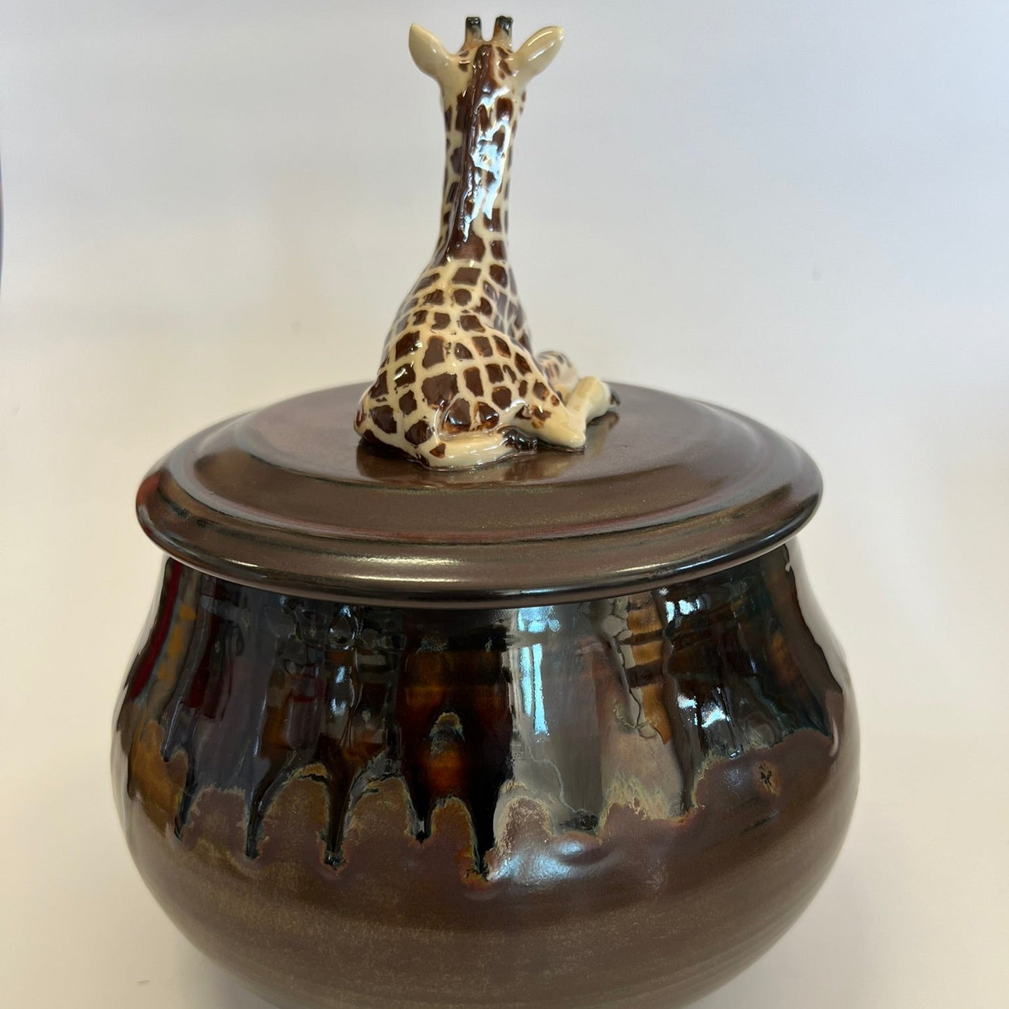 Available Giraffe on Red Brown